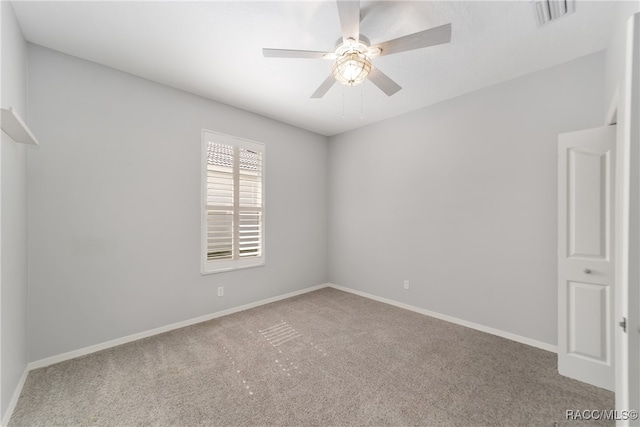 empty room featuring carpet flooring and ceiling fan