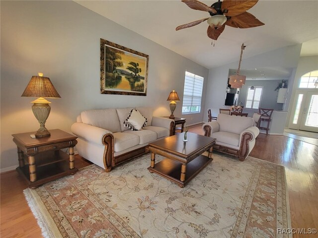 902 W Silver Meadow Loop, Hernando, FL 34442 - living room with wood finished floors, ceiling fan, vaulted ceiling, and baseboards