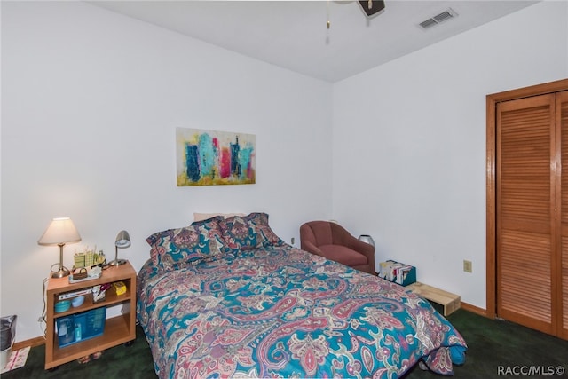 carpeted bedroom featuring a closet