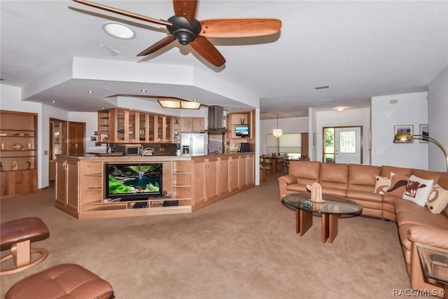 living room featuring ceiling fan and light colored carpet