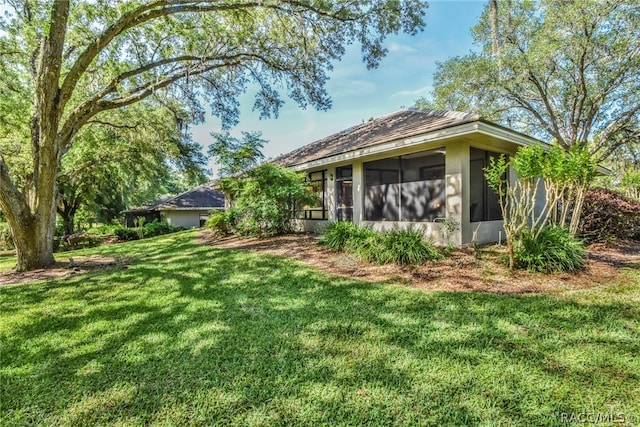 view of yard featuring a sunroom