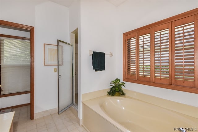 bathroom featuring tile patterned floors and plus walk in shower