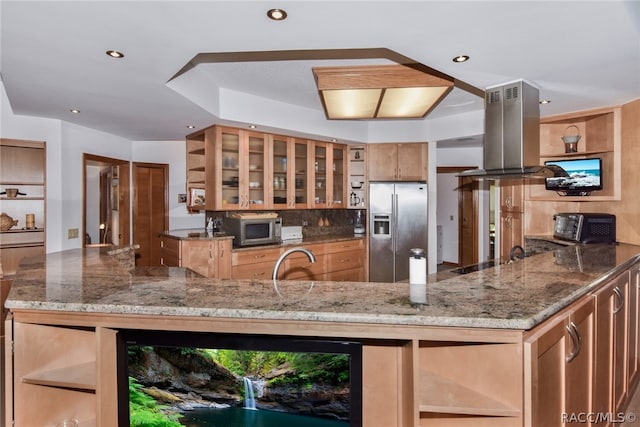 kitchen featuring stone counters, sink, stainless steel appliances, tasteful backsplash, and island exhaust hood