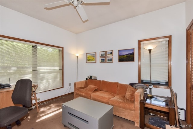 living room with dark carpet and ceiling fan