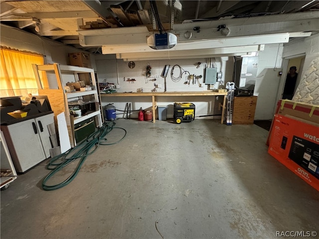 garage featuring a workshop area and a garage door opener