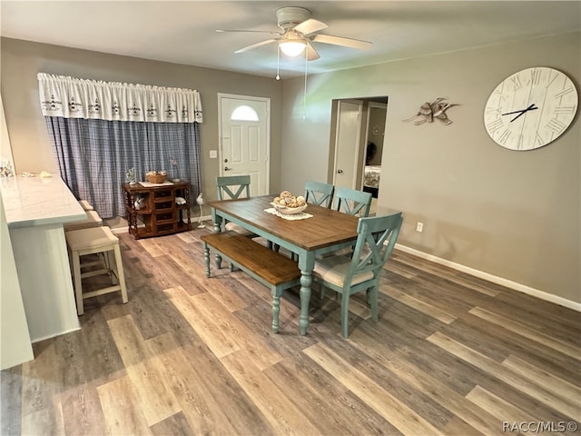 dining room featuring hardwood / wood-style floors and ceiling fan