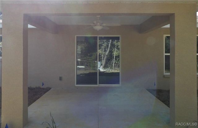 view of patio featuring ceiling fan