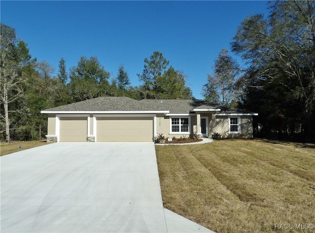 ranch-style home with a garage and a front lawn