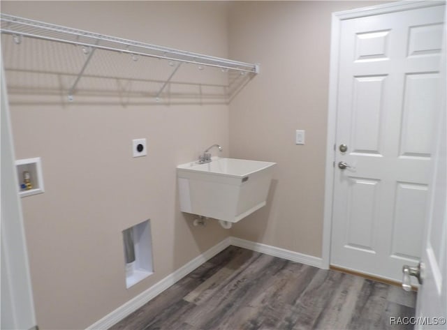 laundry room featuring washer hookup, hookup for an electric dryer, sink, and dark wood-type flooring