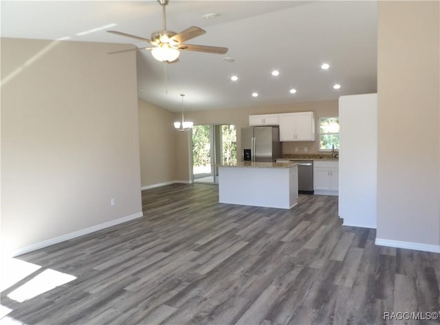 kitchen featuring white cabinets, stainless steel appliances, plenty of natural light, and dark hardwood / wood-style floors