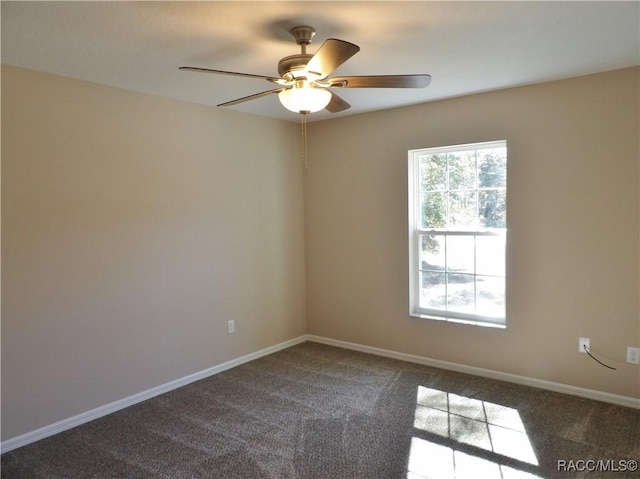 unfurnished room with ceiling fan and carpet floors