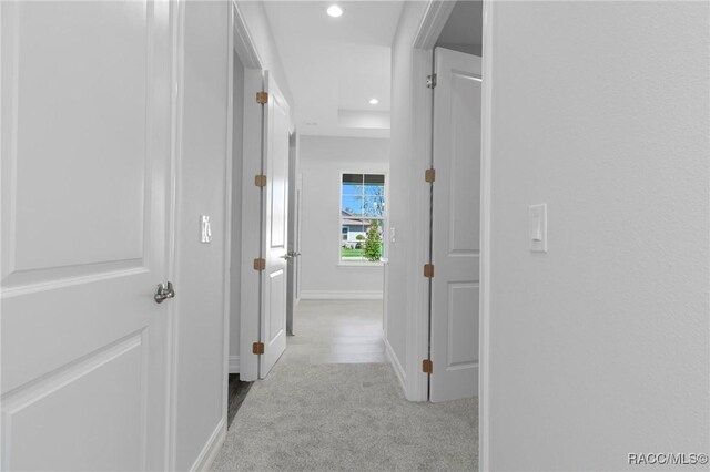 hallway featuring recessed lighting, carpet flooring, and baseboards