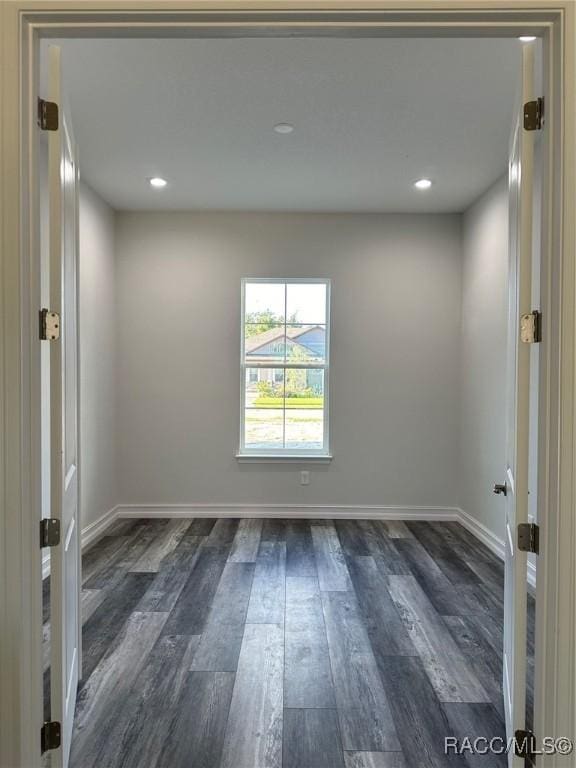 spare room featuring dark hardwood / wood-style floors