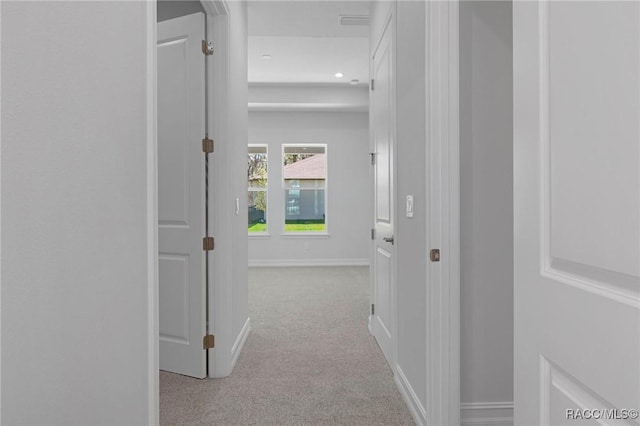 corridor featuring carpet floors, recessed lighting, and baseboards