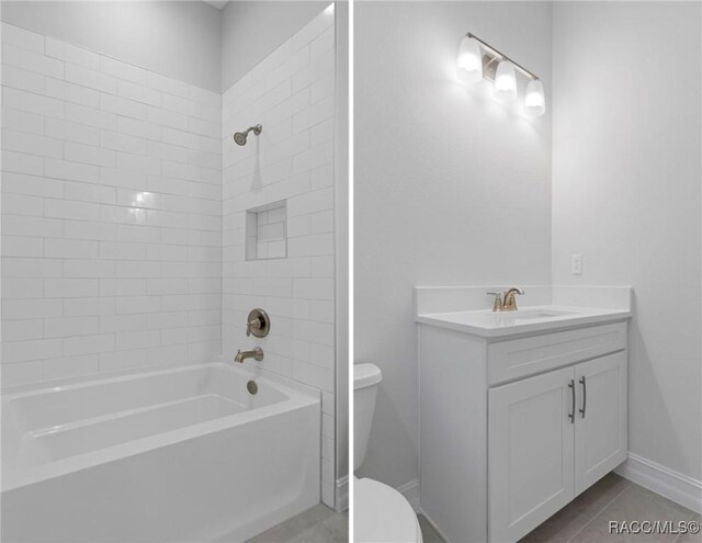 bathroom with toilet, vanity,  shower combination, tile patterned flooring, and baseboards