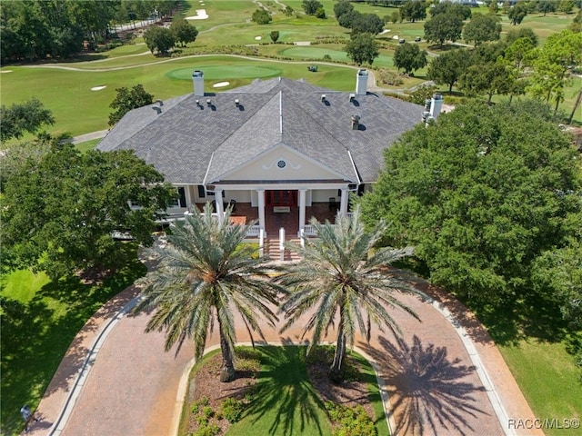 exterior space with covered porch and golf course view