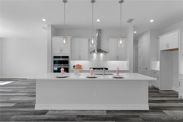 unfurnished living room featuring dark hardwood / wood-style flooring and a notable chandelier