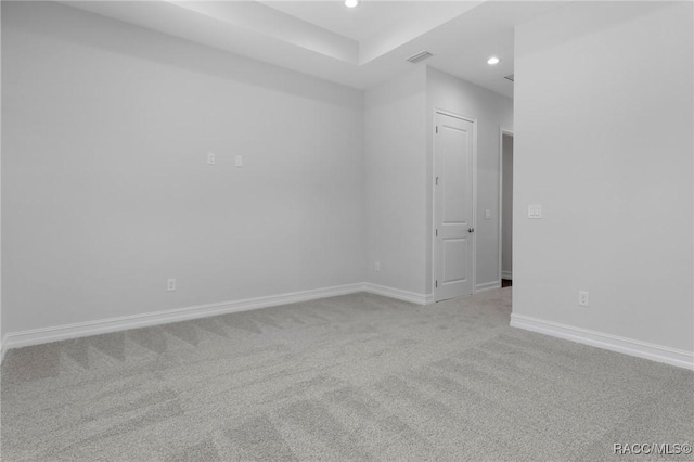 unfurnished room with recessed lighting, carpet flooring, and baseboards