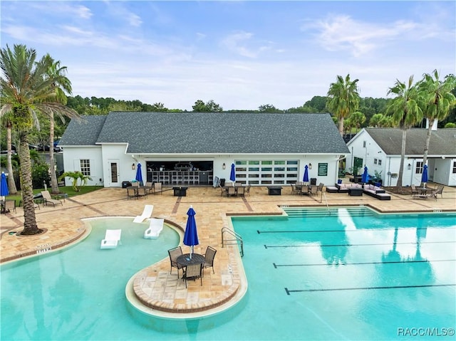 community pool with a patio area