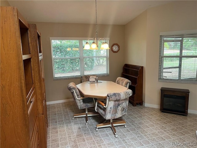 dining area featuring an inviting chandelier