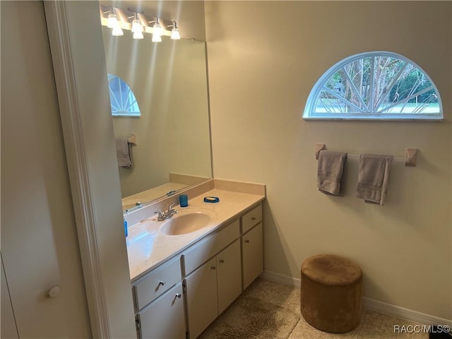 bathroom with tile patterned flooring and vanity