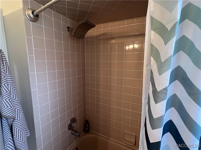 bathroom with shower / tub combo with curtain