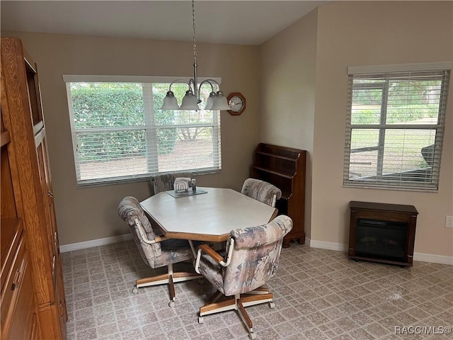 dining room featuring a notable chandelier