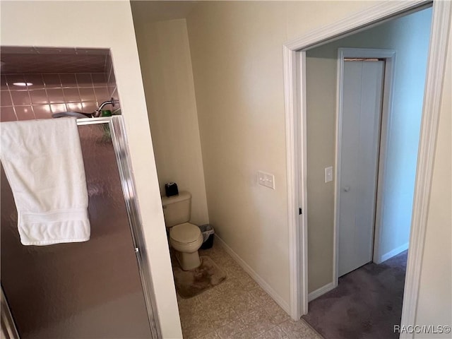 bathroom with toilet and walk in shower