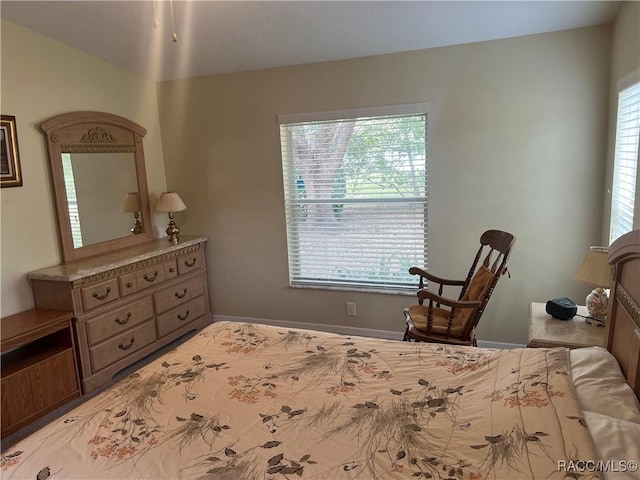 bedroom featuring multiple windows