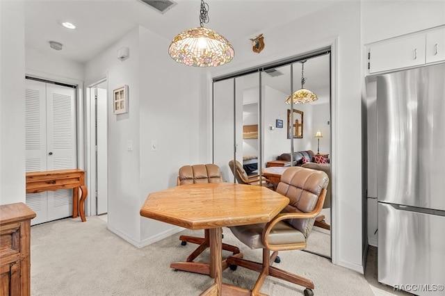 view of carpeted dining area