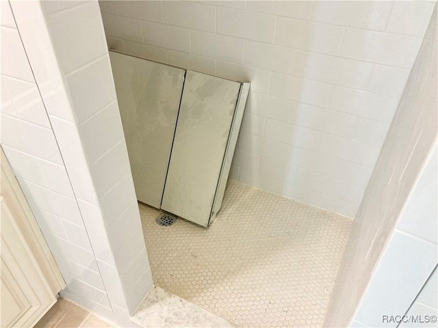 bathroom with tile patterned floors