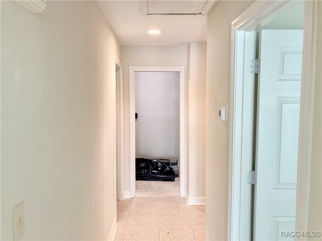 hall with light tile patterned floors