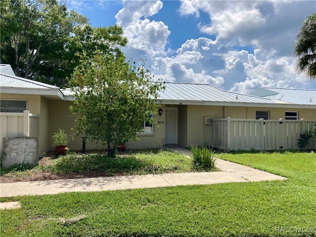 view of front of home with a front yard