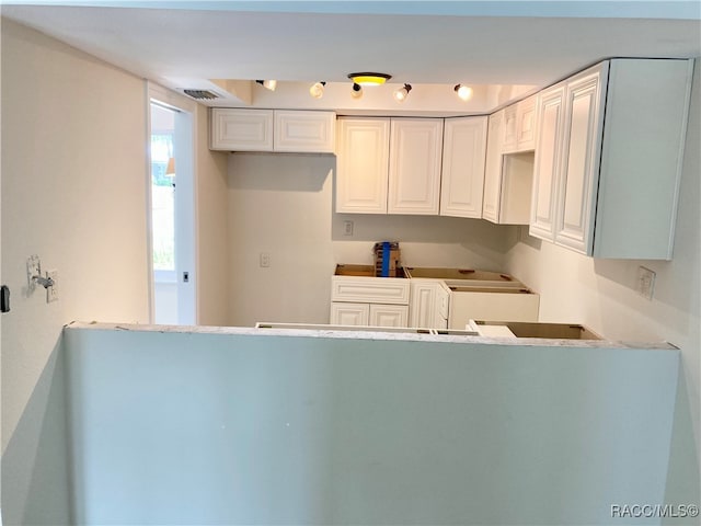 kitchen with white cabinets