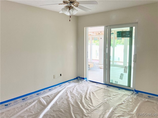 unfurnished room with ceiling fan