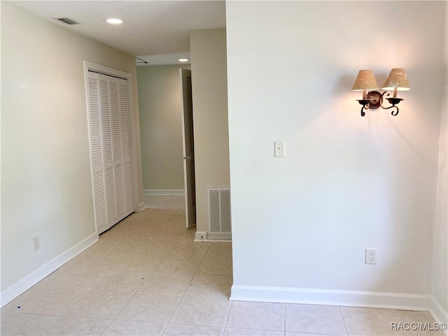 hallway with light tile patterned flooring