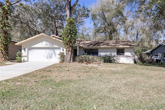 ranch-style home with a garage, stucco siding, driveway, and a front lawn