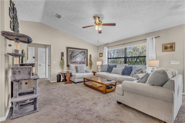 carpeted living area featuring baseboards, a textured ceiling, a ceiling fan, and lofted ceiling