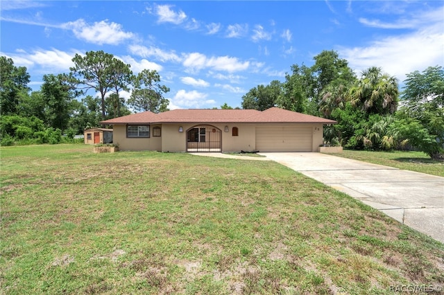 ranch-style home with an attached garage, driveway, a front lawn, and stucco siding