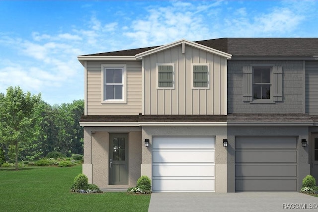 view of front of house with a garage and a front lawn