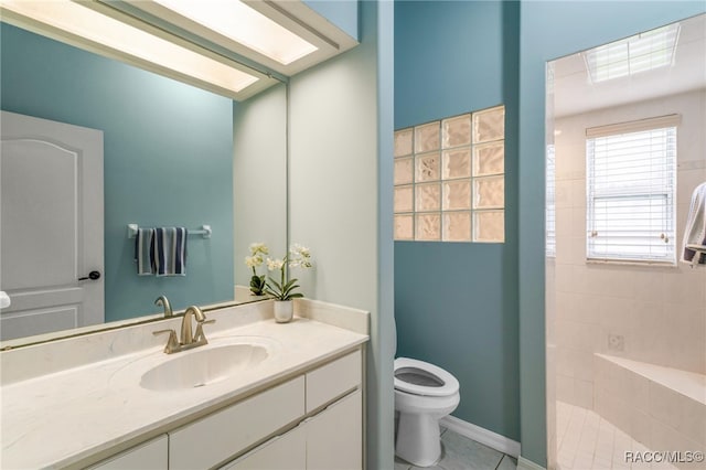 bathroom featuring vanity, tile patterned floors, and toilet