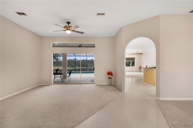 carpeted empty room with ceiling fan