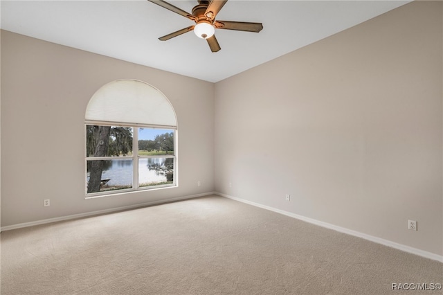 empty room featuring ceiling fan and carpet flooring