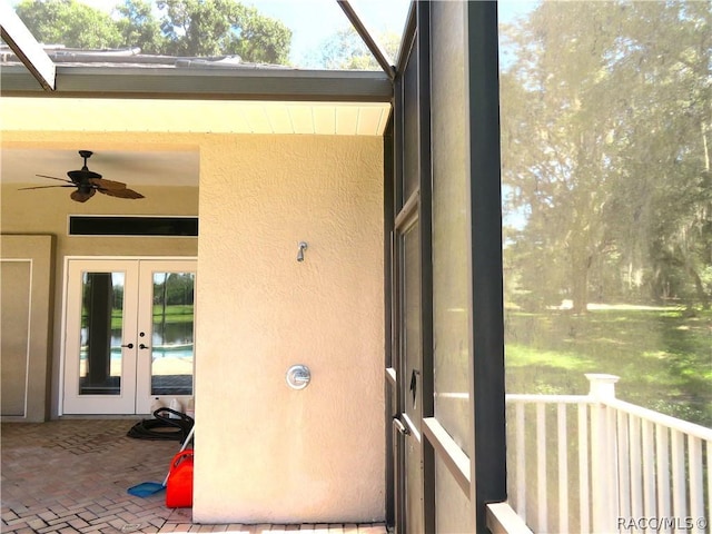 doorway to property featuring french doors and ceiling fan