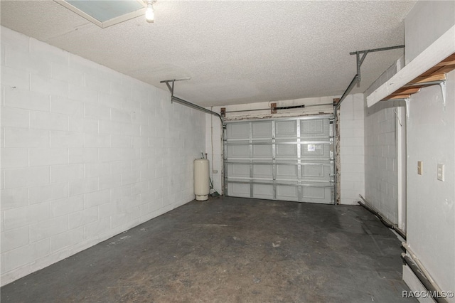 garage with concrete block wall