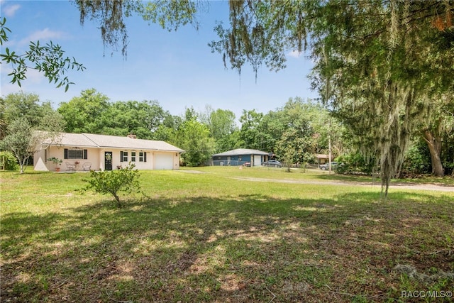 view of yard featuring an attached garage