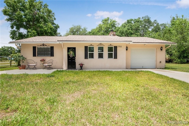 ranch-style house with a front yard, stucco siding, and a garage