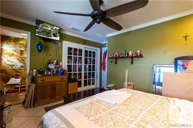 bedroom featuring a textured ceiling, ceiling fan, light tile patterned floors, and crown molding