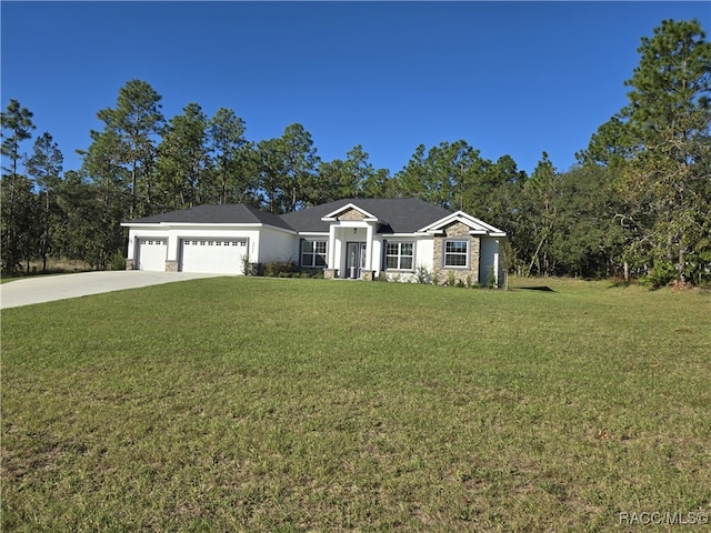 ranch-style home with a garage and a front lawn