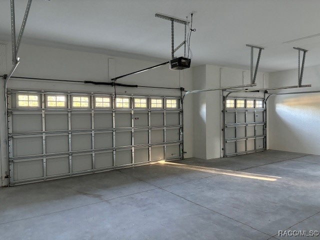 garage featuring a garage door opener